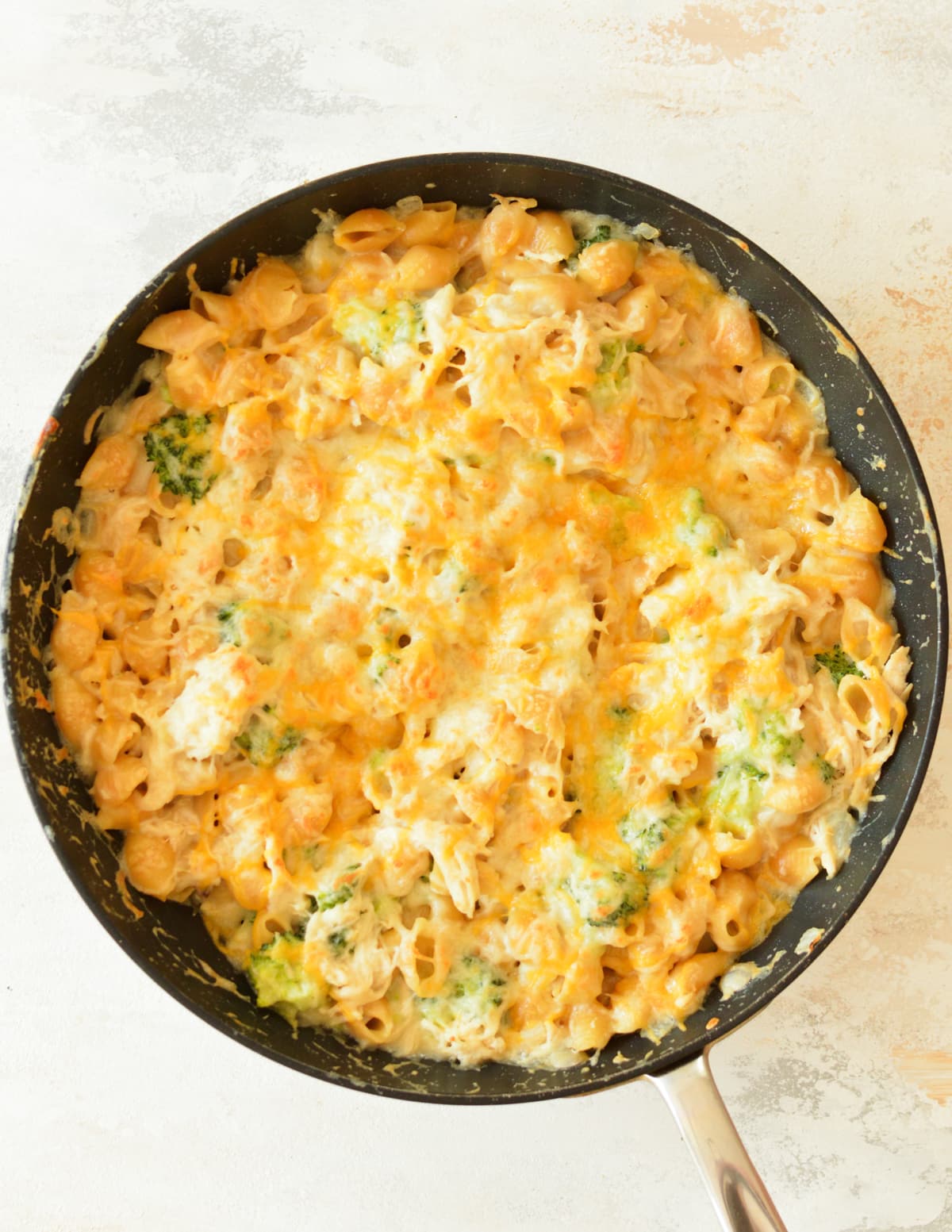 chicken broccoli and pasta casserole in a skillet