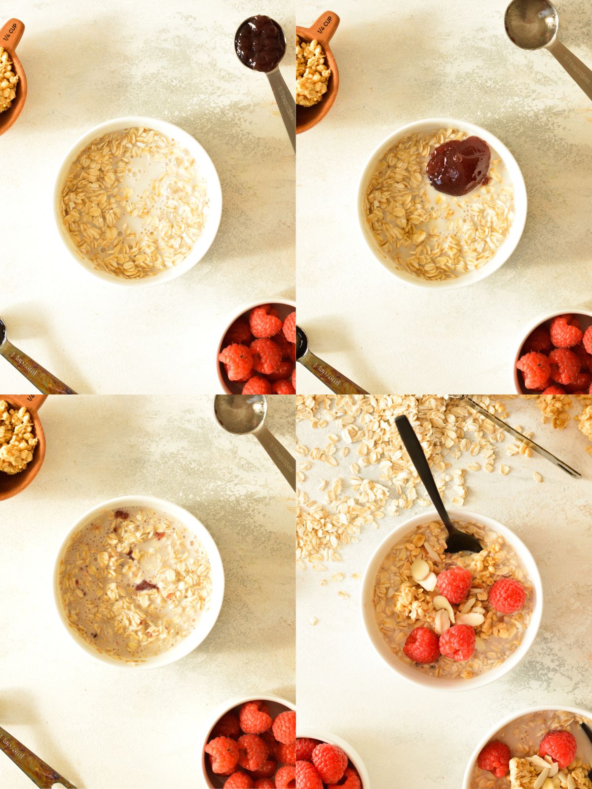 a bowl of oats with milk, jam, and raspberries