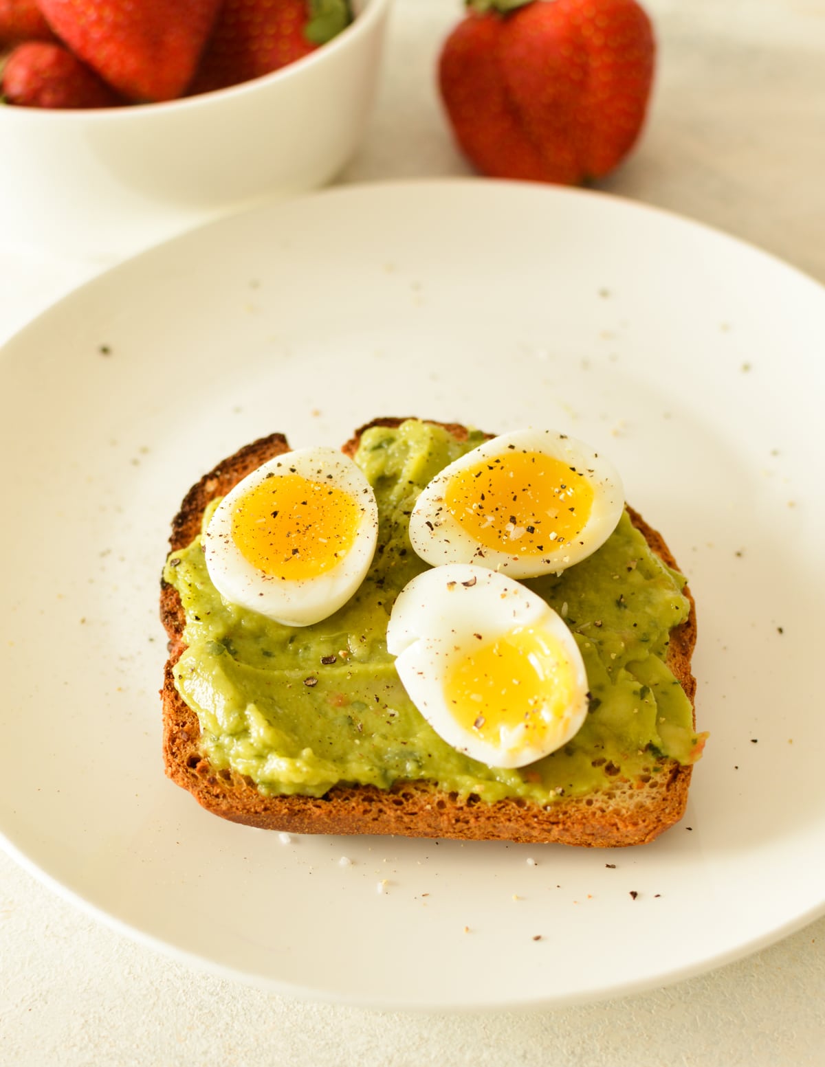 soft boiled quail eggs on avocado toast