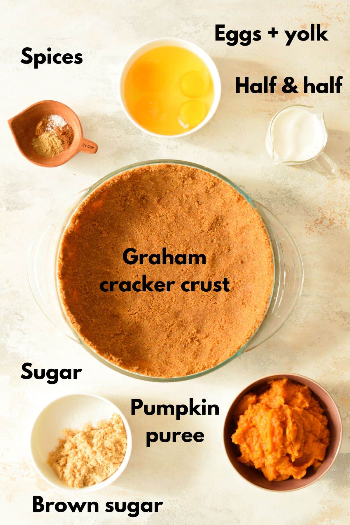 ingredients for a pumpkin pie with a graham cracker crust