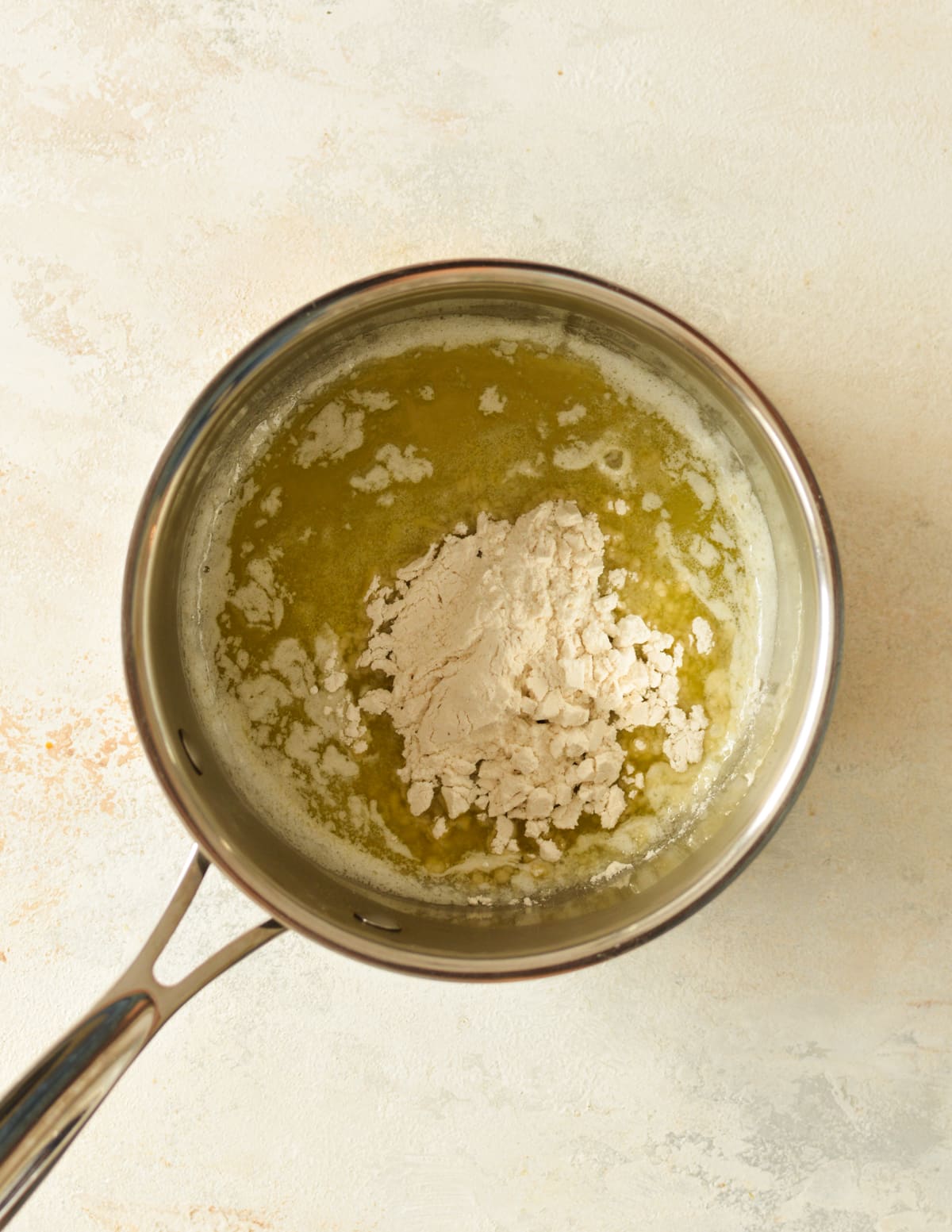 melted butter and gluten free flour in a saucepan