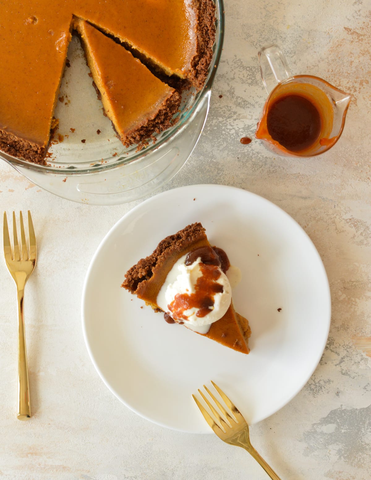 a slice of pumpkin pie with ice cream