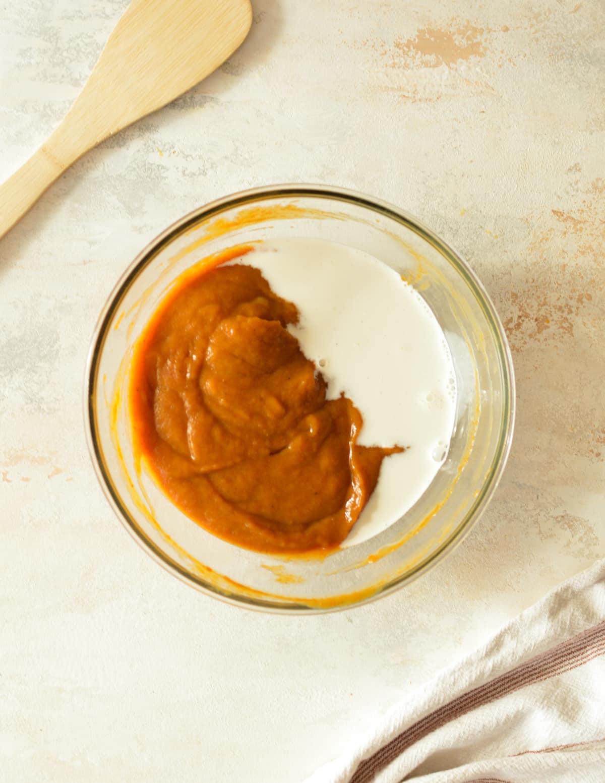 a bowl of pumpkin with half and half on it