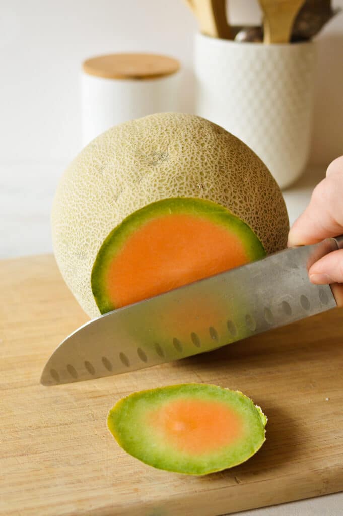 a cantaloupe with the top cut off.