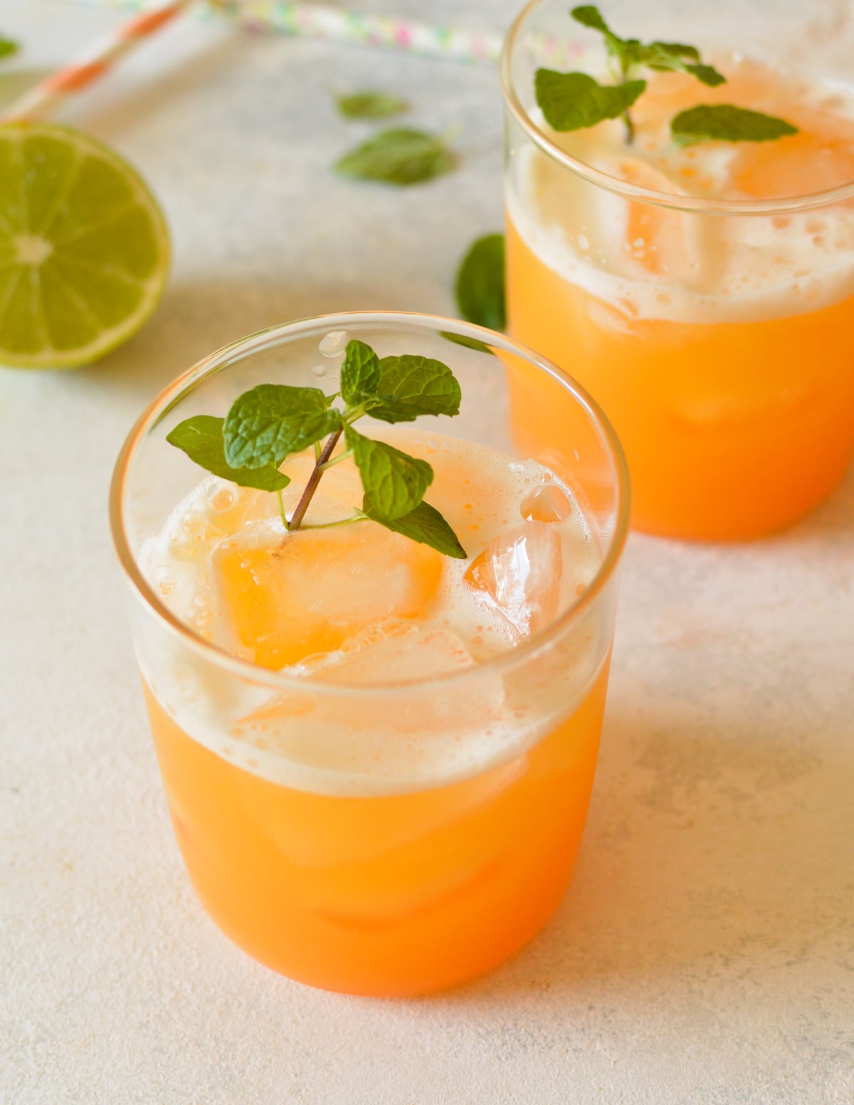 two glasses of cantaloupe juice with mint