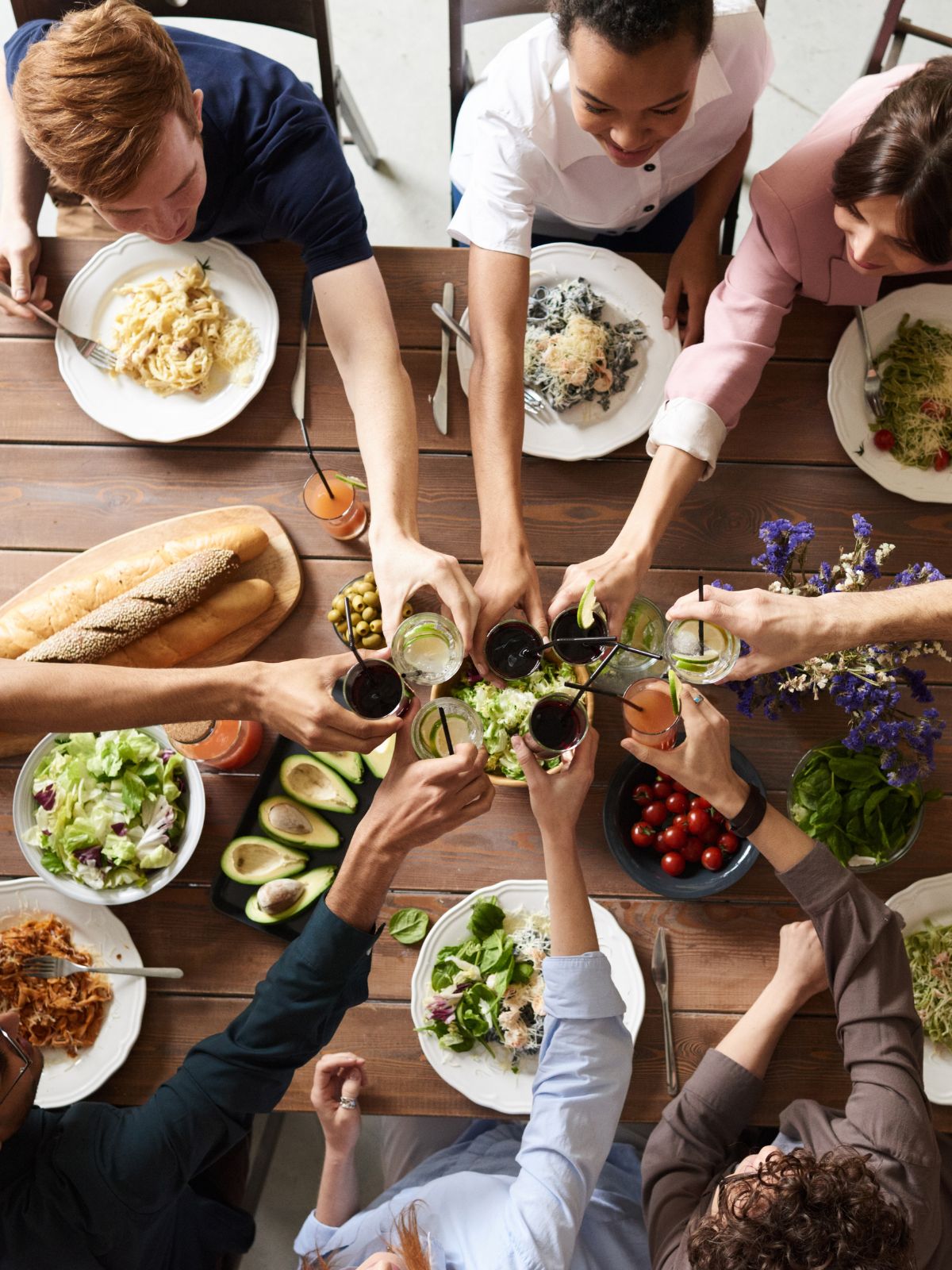 a group of people eating dinner.