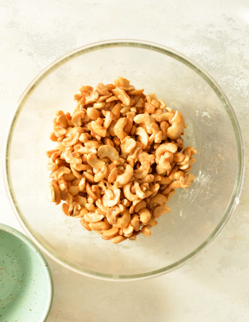 honey coated cashews in a bowl.