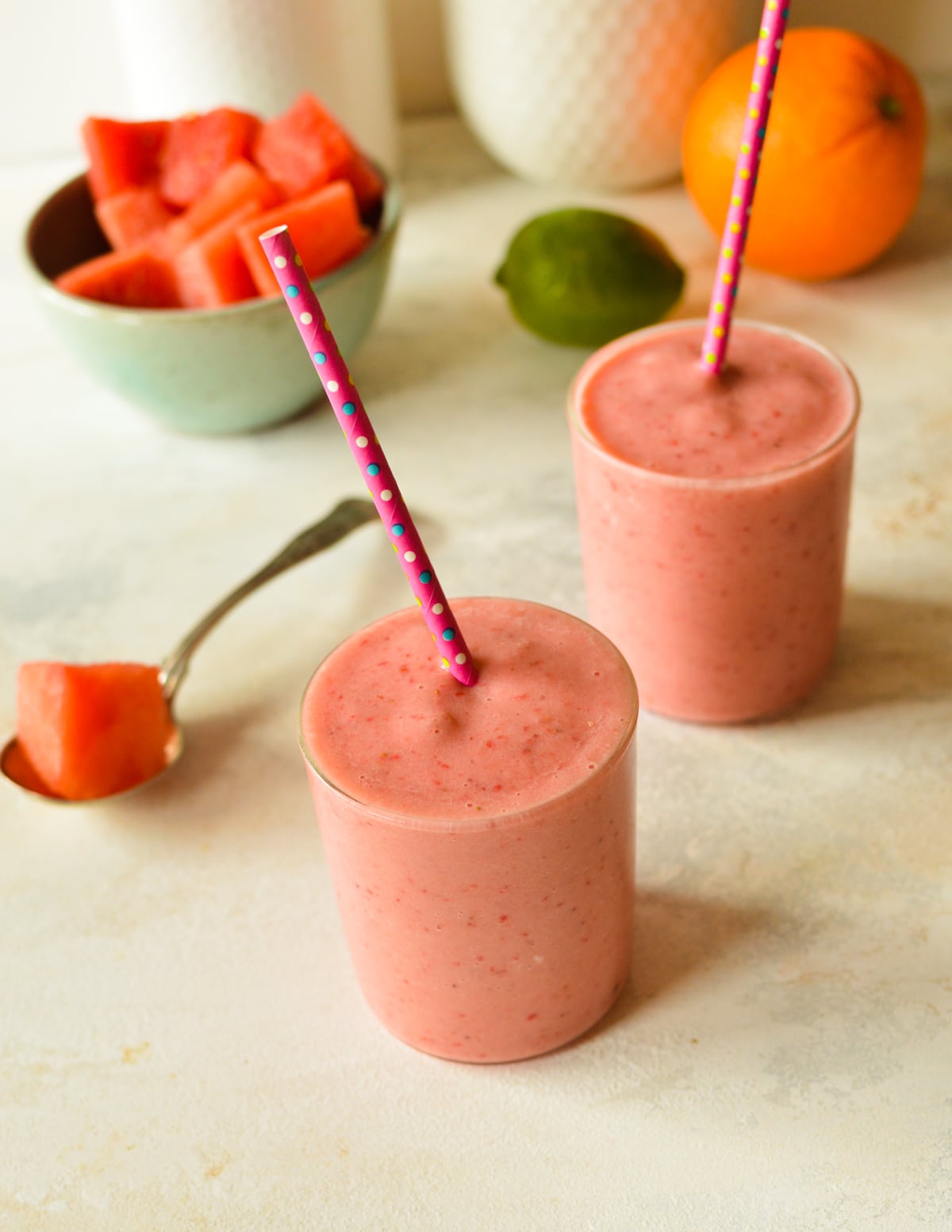 two watermelon smoothies. 