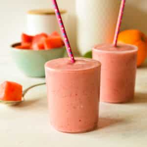 watermelon smoothies with straws.