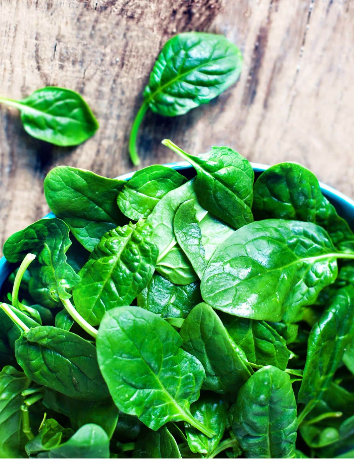 a bowl of fresh spinach. 