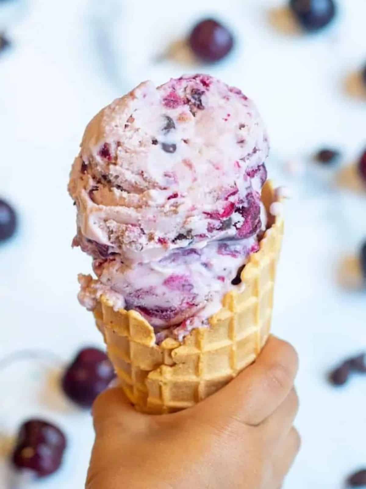 cherry ice cream on a cone.