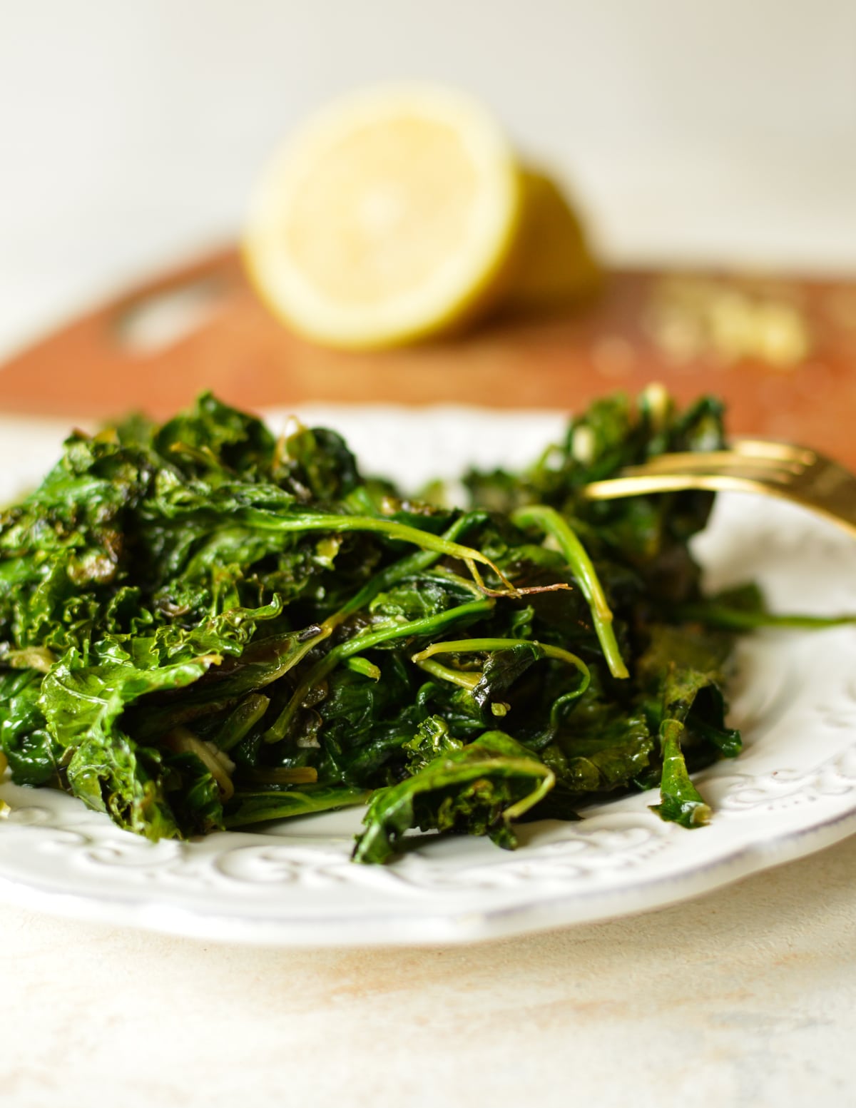 a plate of sauteed spinach and kale.