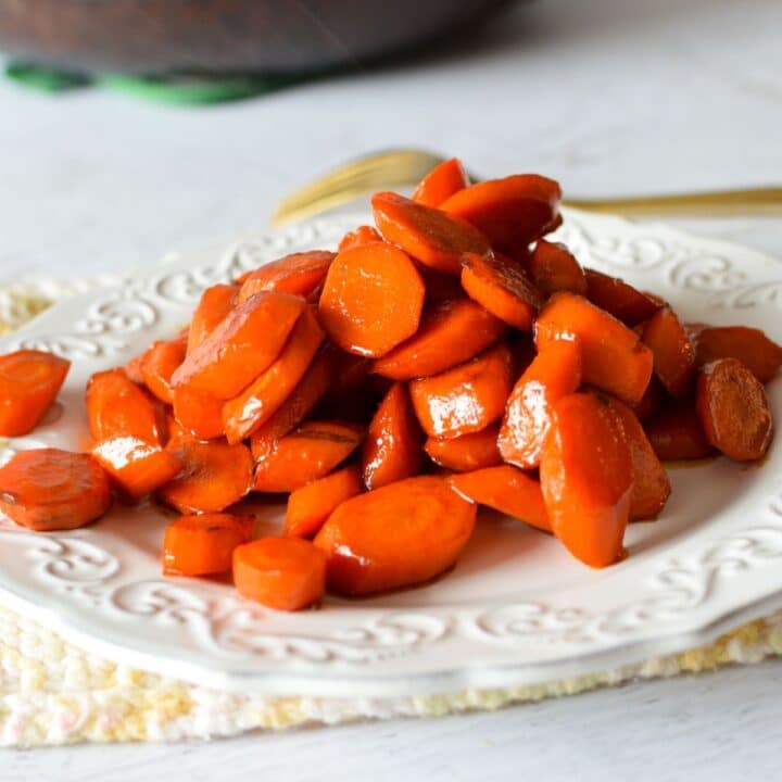a plate of glazed carrots.