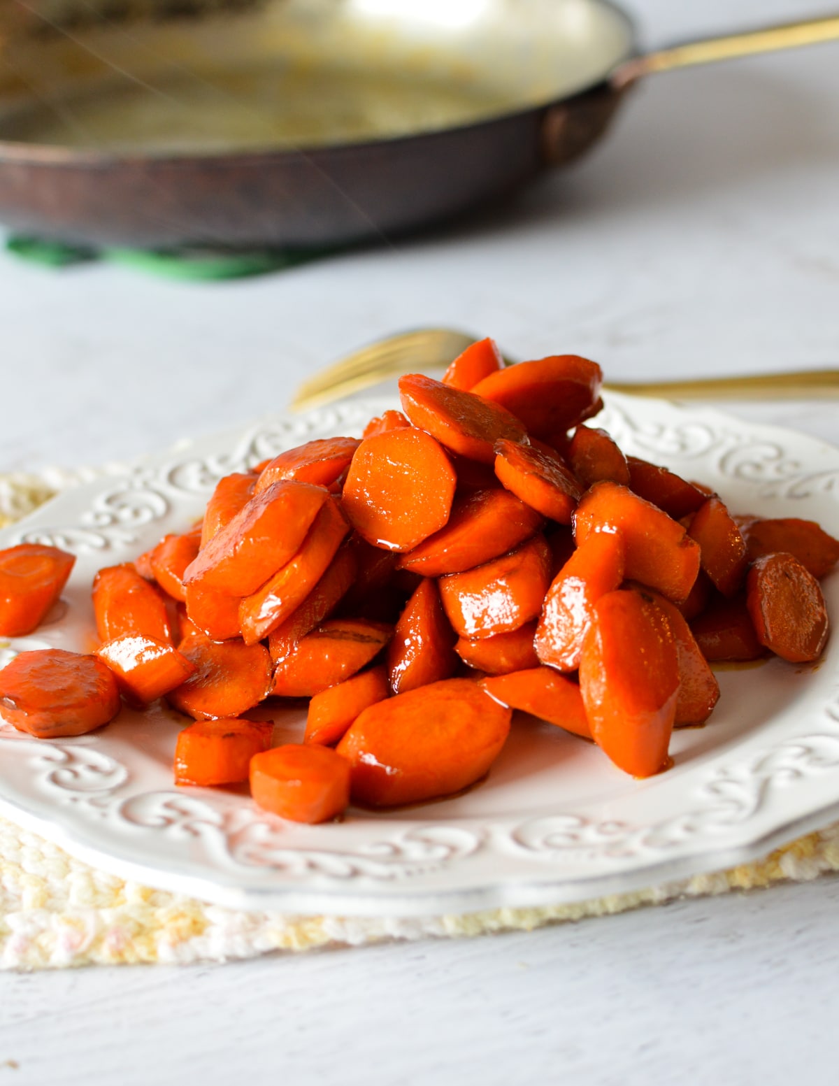 glazed stovetop carrots on a plate.