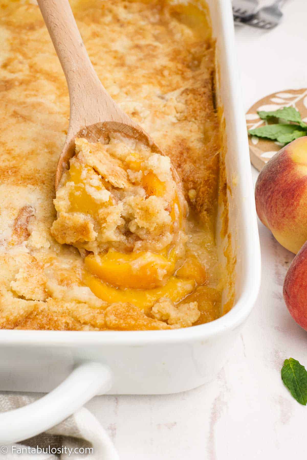 a large spoonful of peach cobbler.