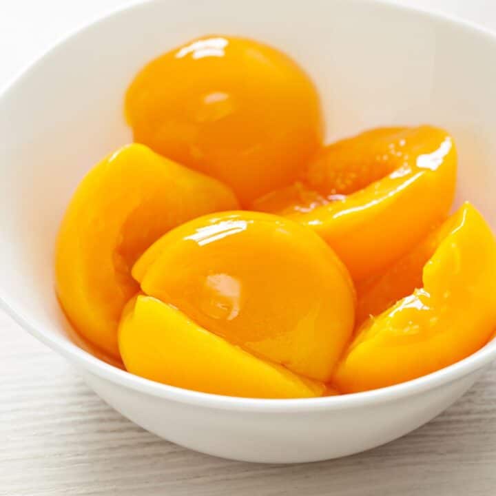 a bowl of canned peaches.