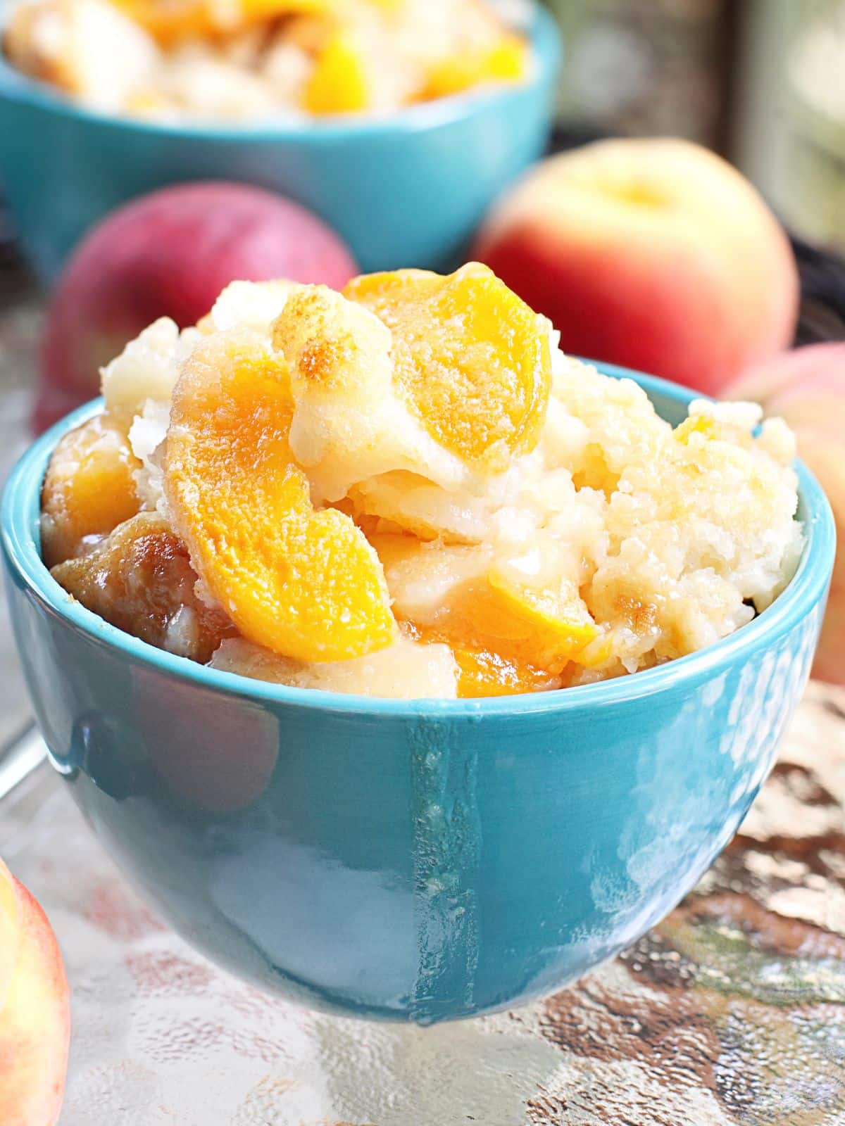 a bowl of ice cream with frozen peaches.