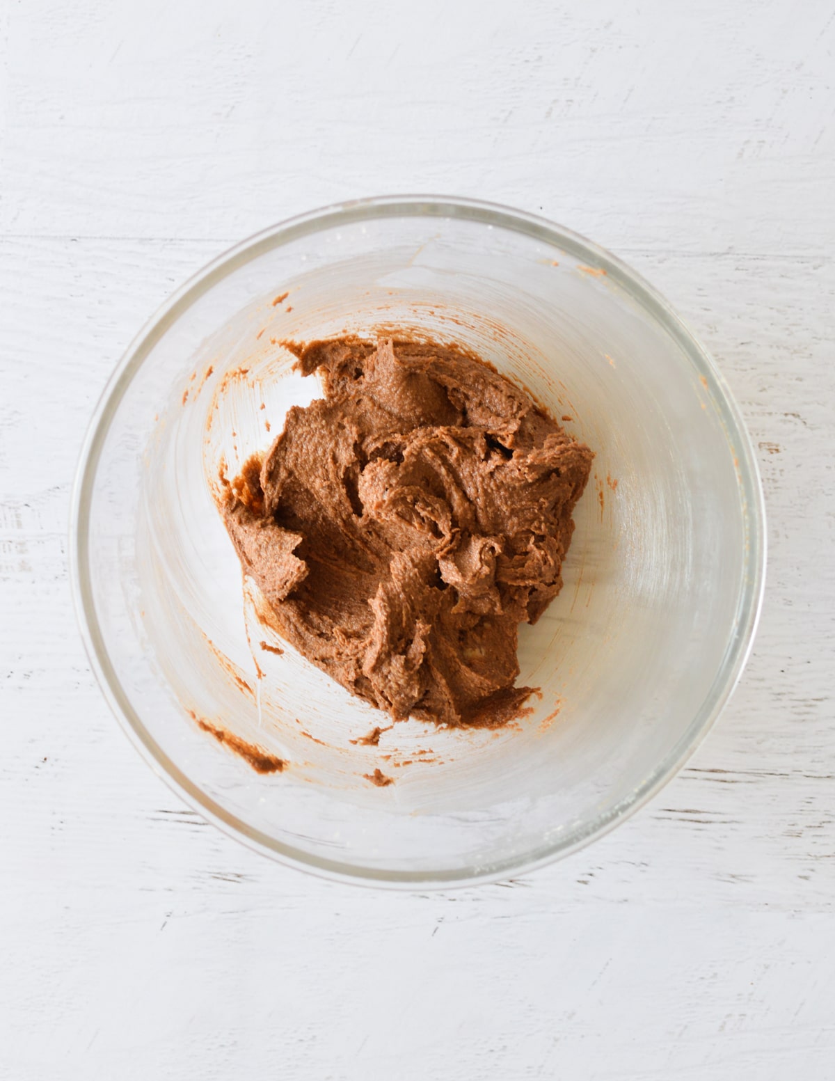 creamed butter and chocolate in bowl.