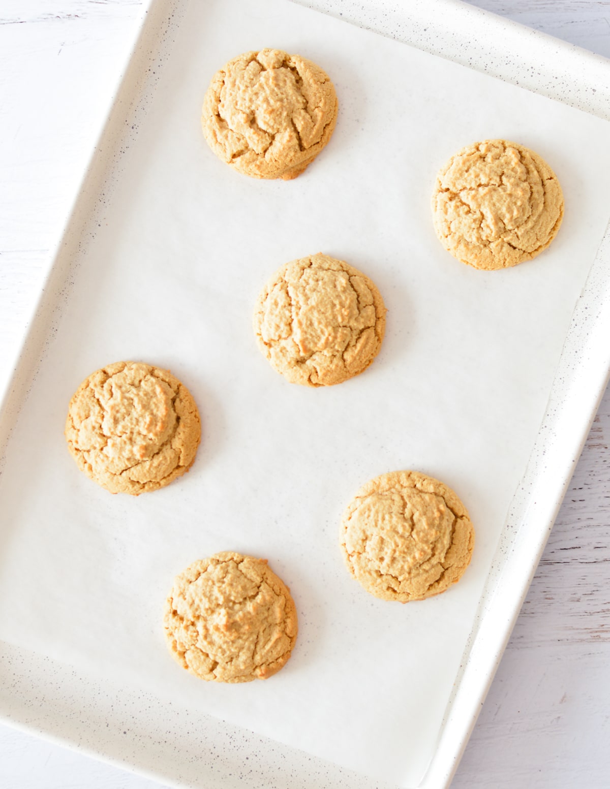 peanut butter cookies on a sheet pan.