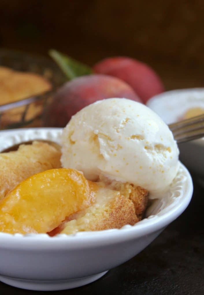 peach cobbler with ice cream on top.