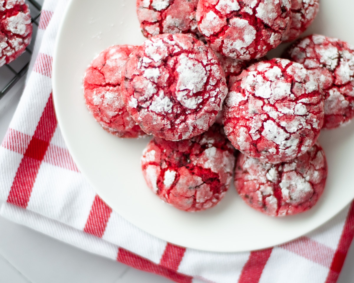 a plate of chocolate cherry crinkle cookies. 