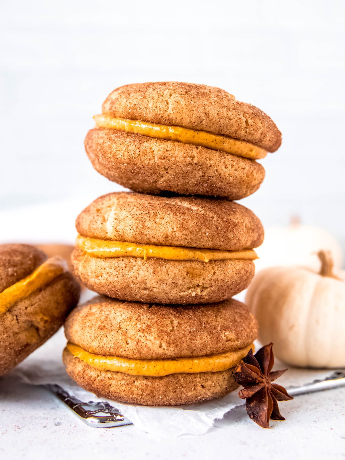 a stack of pumpkin sandwich cookies.