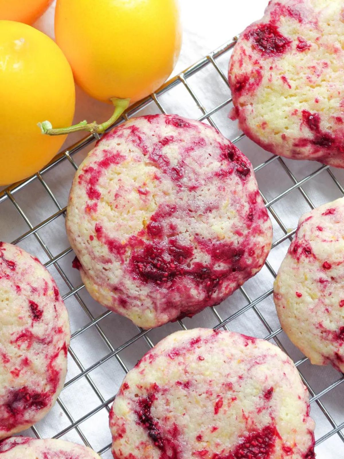 lemon raspberry cookies on cooling rack.