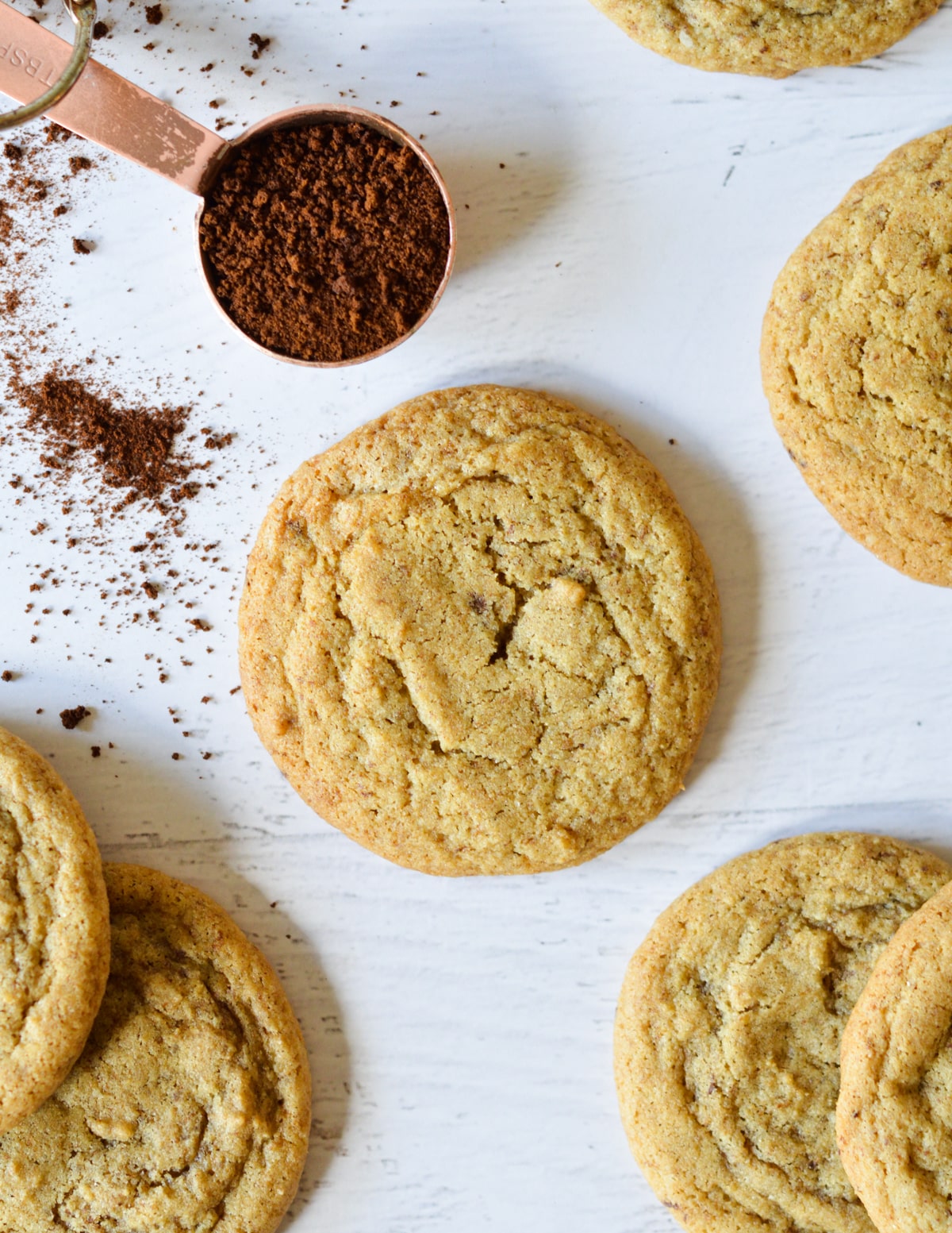 a coffee cookie next to more cookies. 