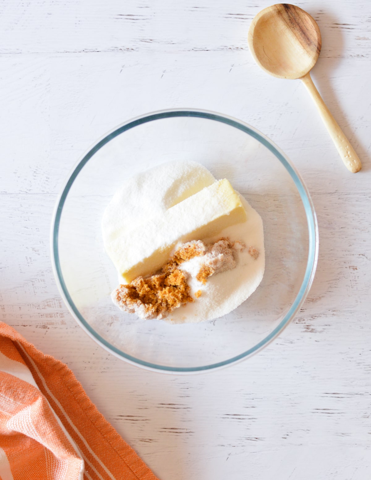 a bowl with butter, brown sugar, and sugar in it. 