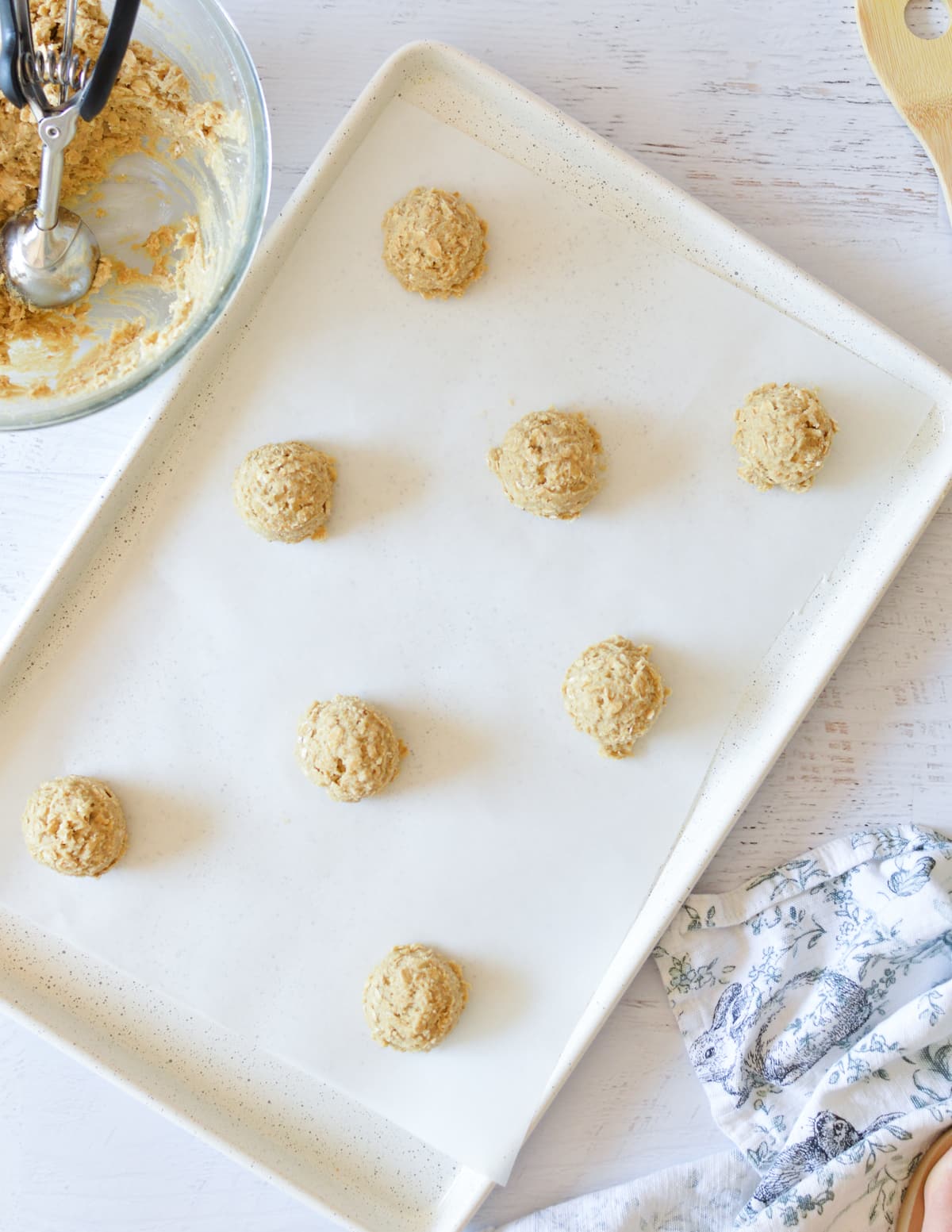 oatmeal cookie dough balls on sheet pan.