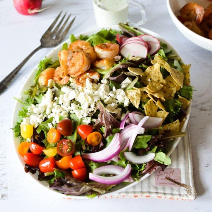 salad with shrimp, red onion, tomatoes, and feta.