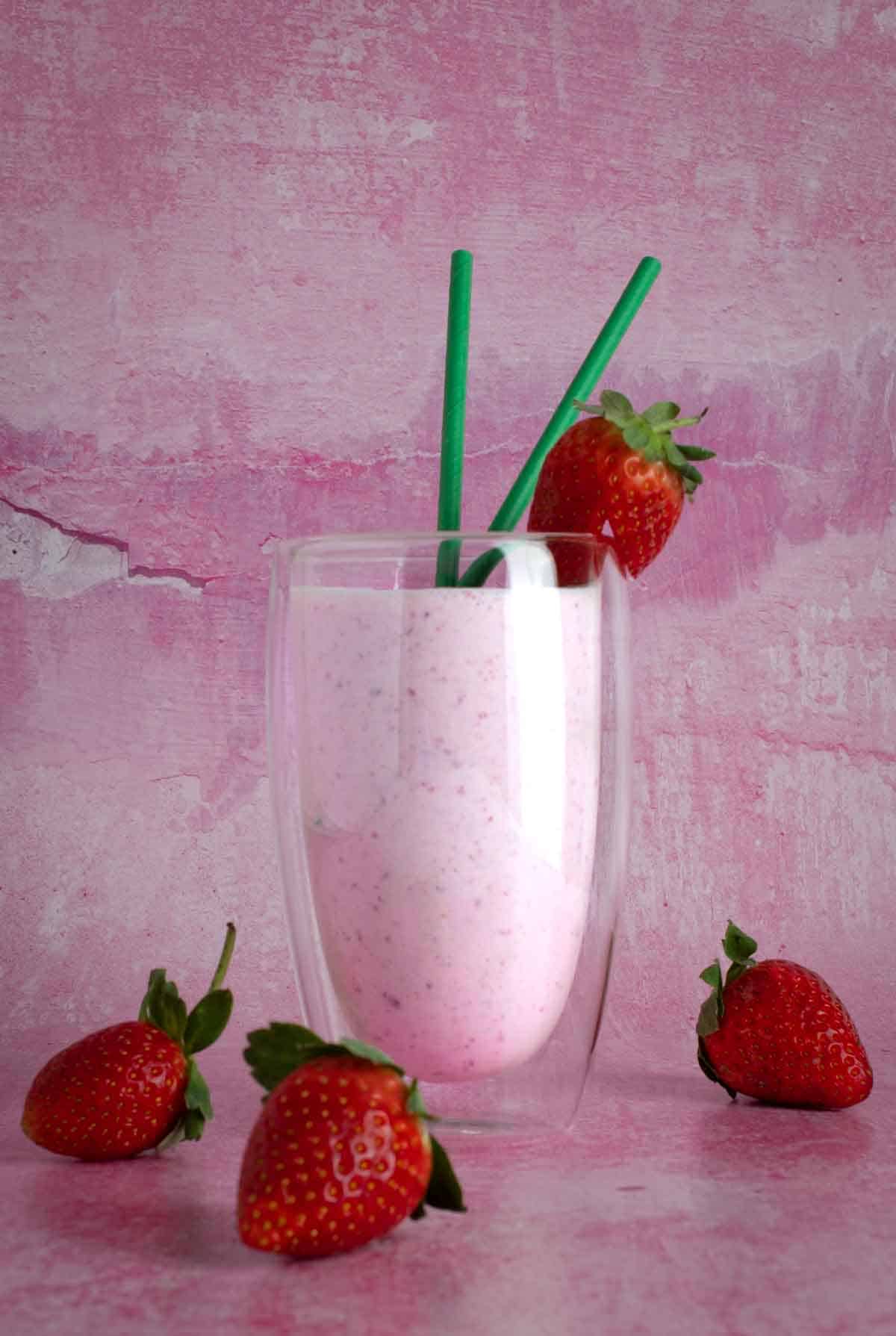 a strawberry lassi in a glass 