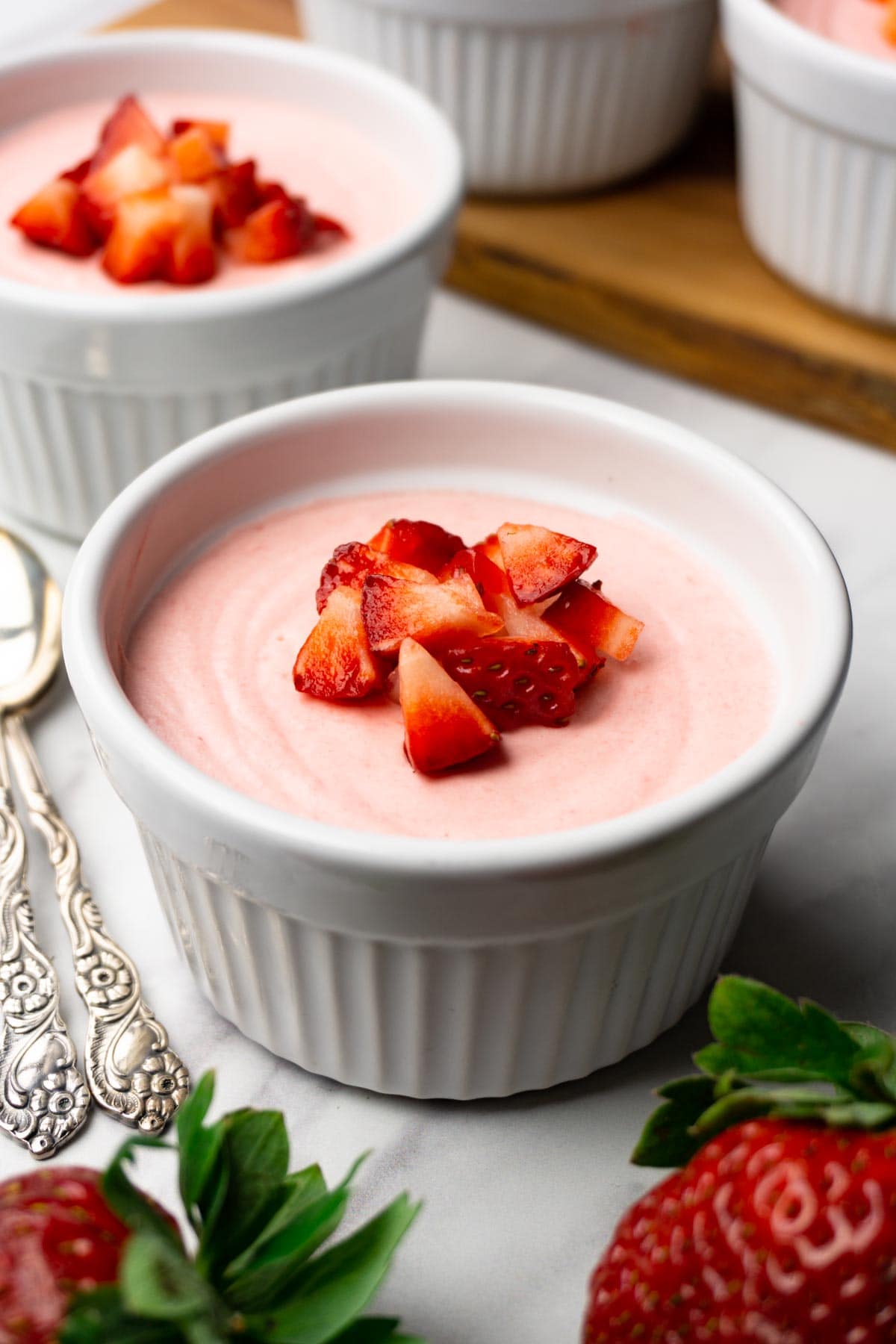 strawberry mousse with diced strawberries on top. 