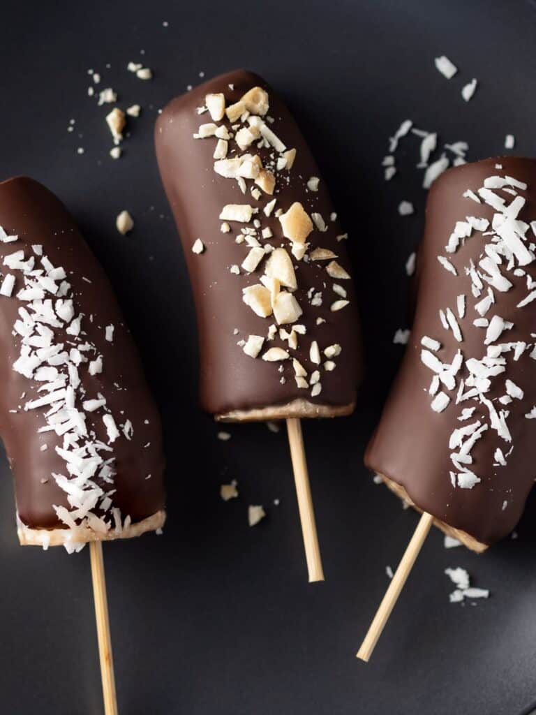 17 Best Frozen Banana Recipes Caramel And Cashews   Bananas Dipped In Chocolate 768x1024 