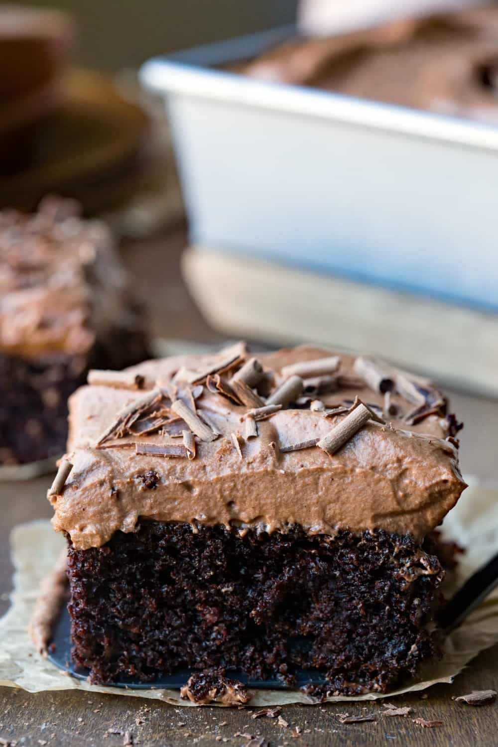 a slice of chocolate cake with mousse frosting.