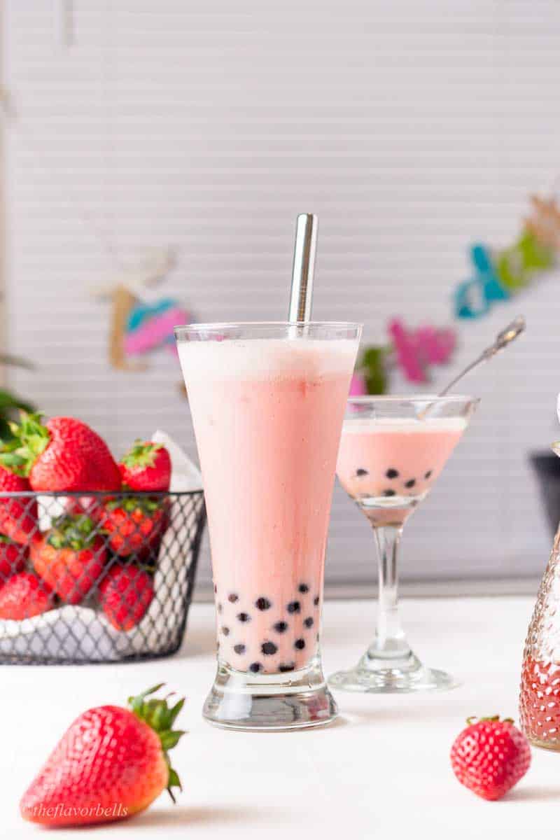 a strawberry milk tea with boba pearls. 