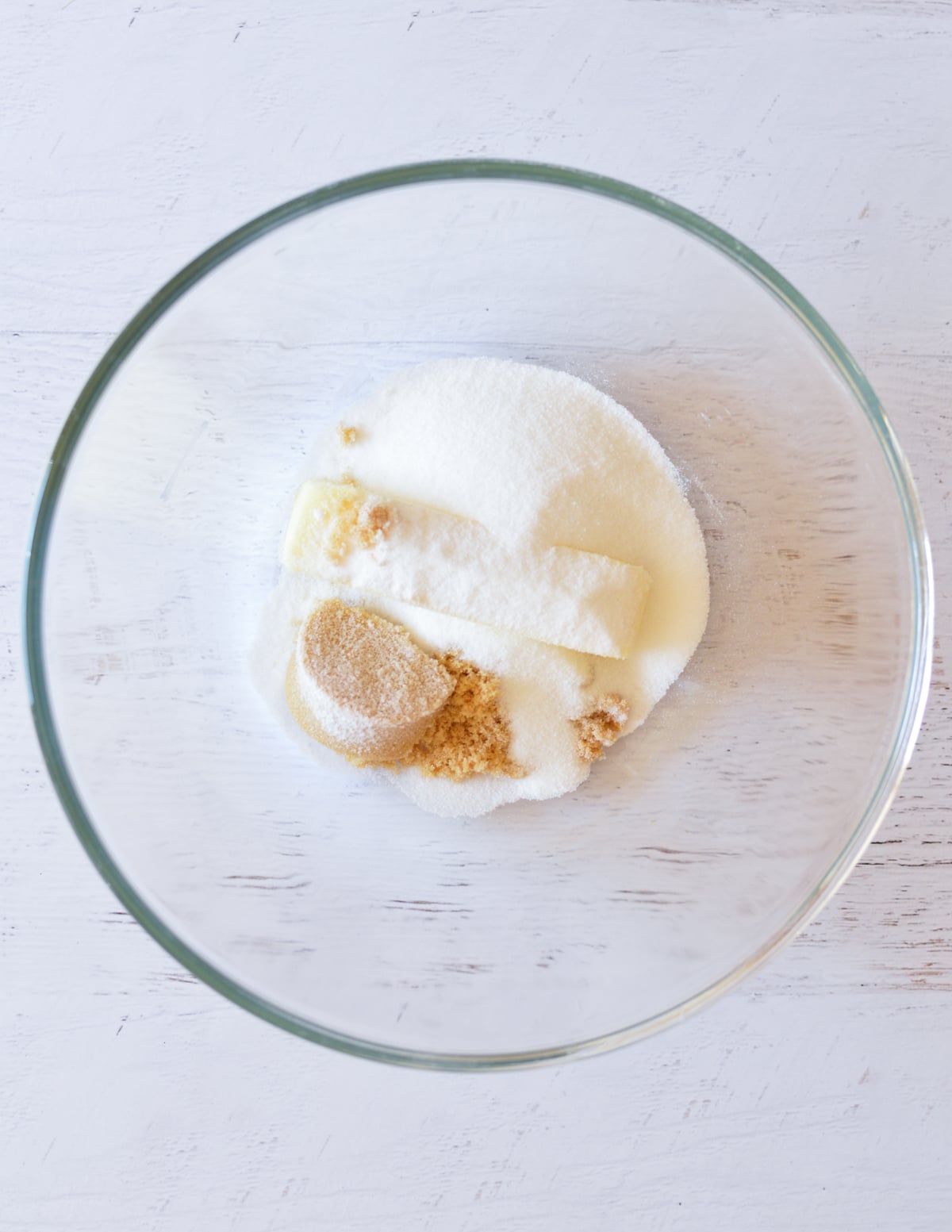 butter, sugar, and brown sugar in a bowl. 