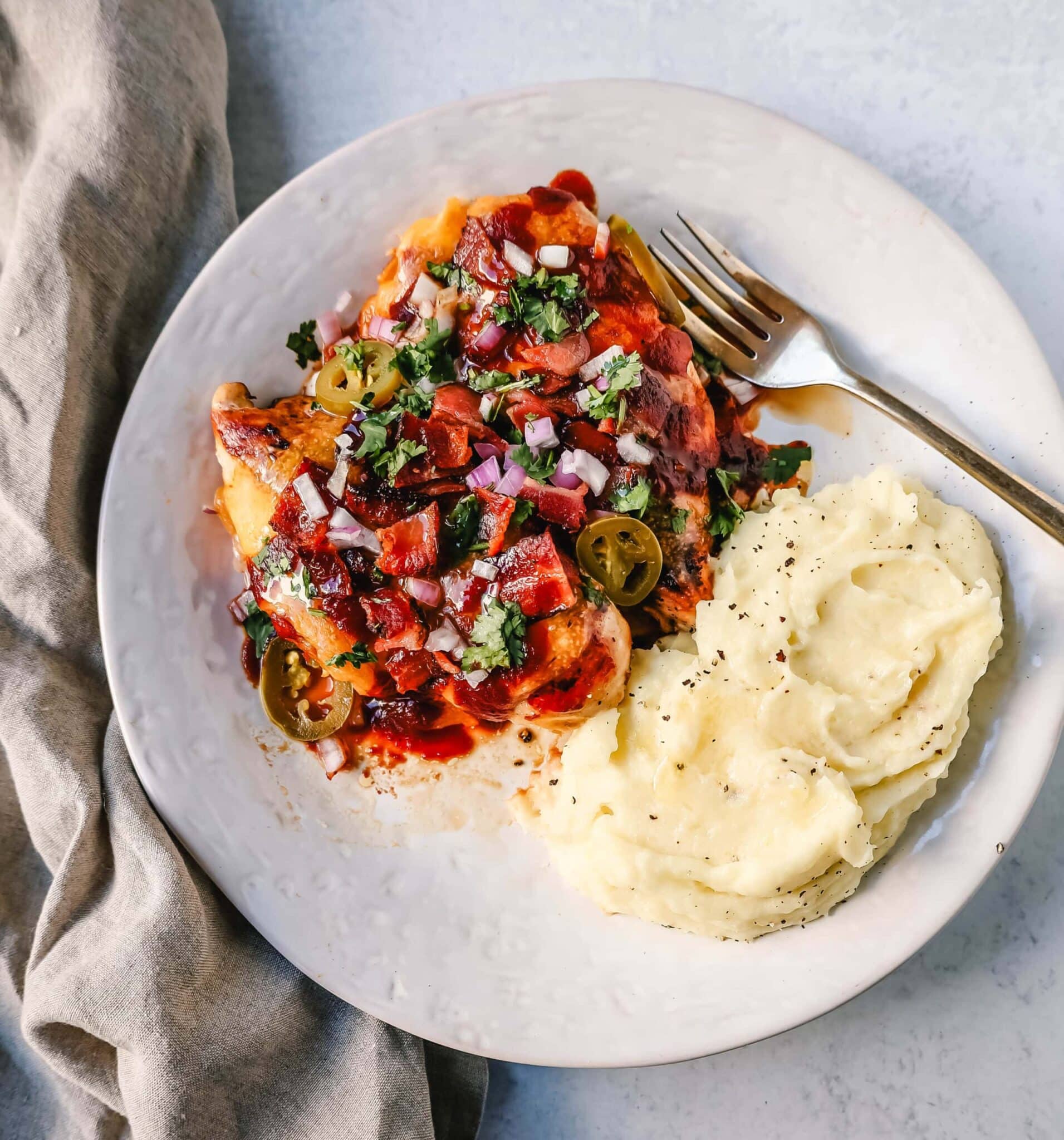 barbecue chicken with bacon and mashed potatoes.