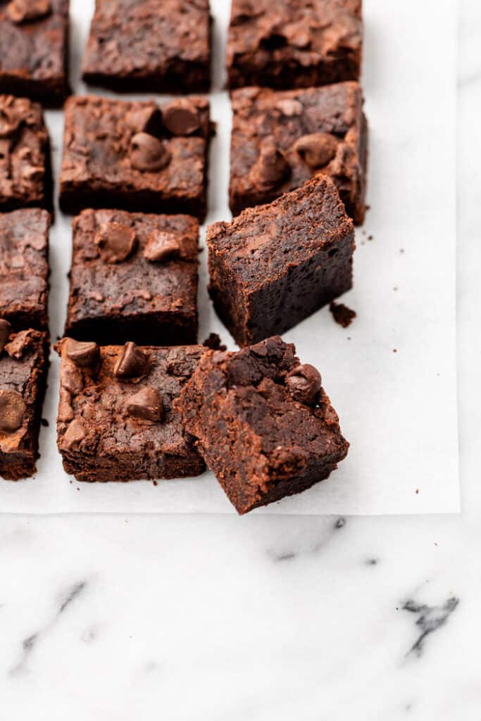 sliced brownies on parchment paper.