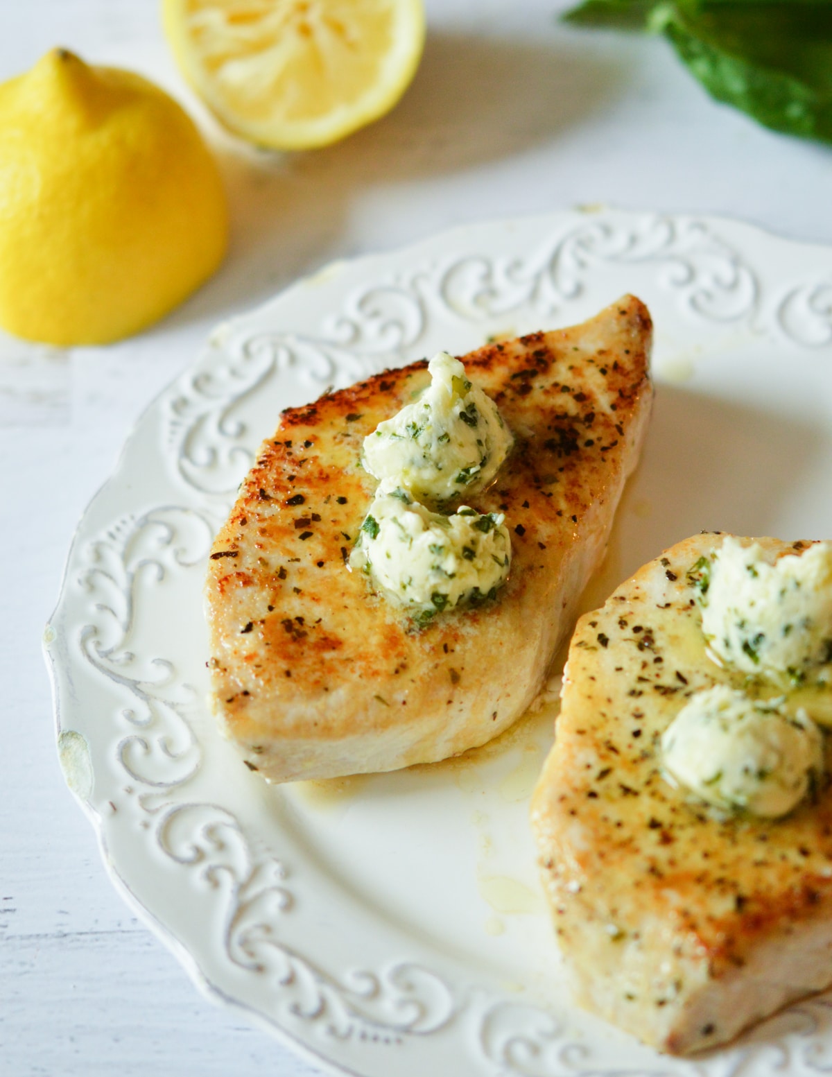 swordfish fillets with lemon basil butter on top. 