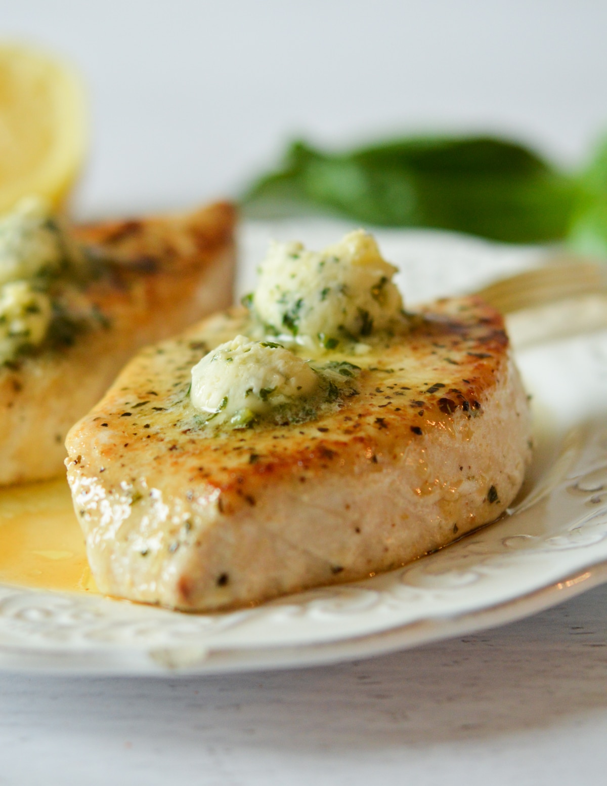 cooked swordfish with lemon basil butter on top. 