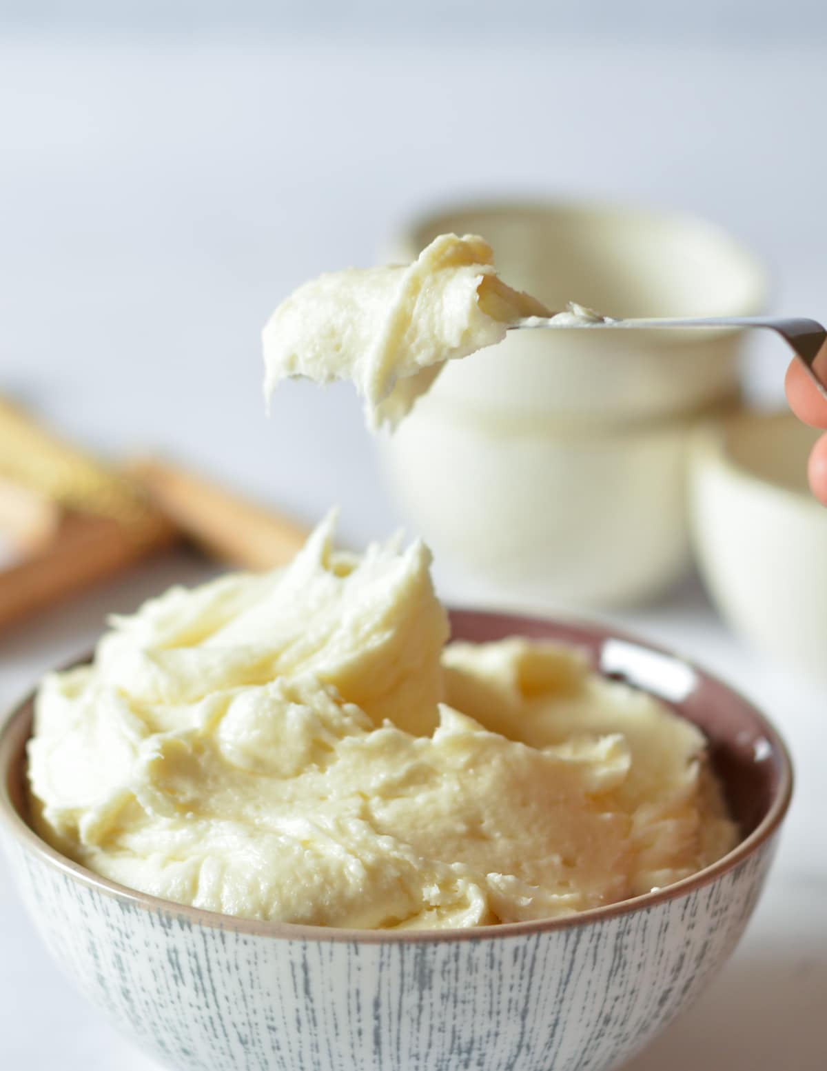 a bowl of cream cheese frosting.