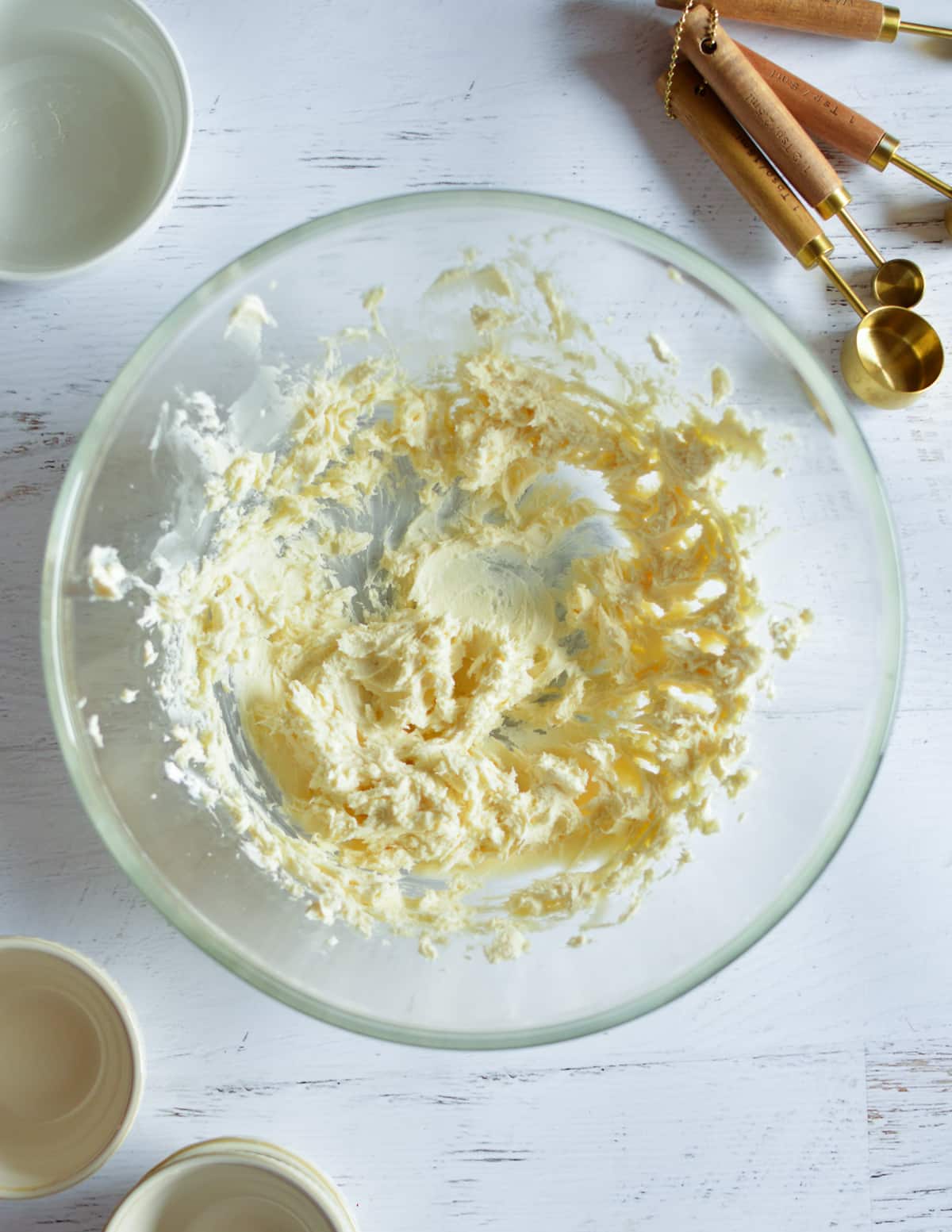 a bowl with whipped cream cheese and butter.