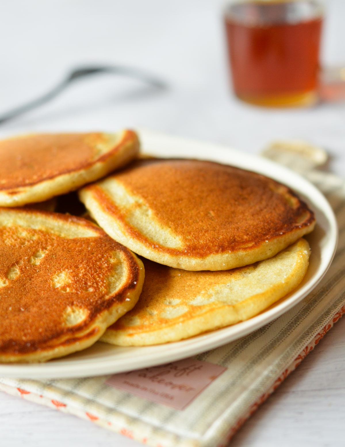 a plate of golden brown pancakes. 