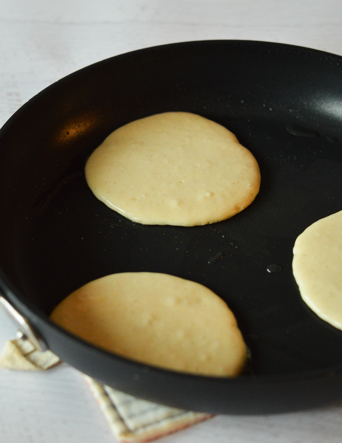 pancake batter in a skillet.
