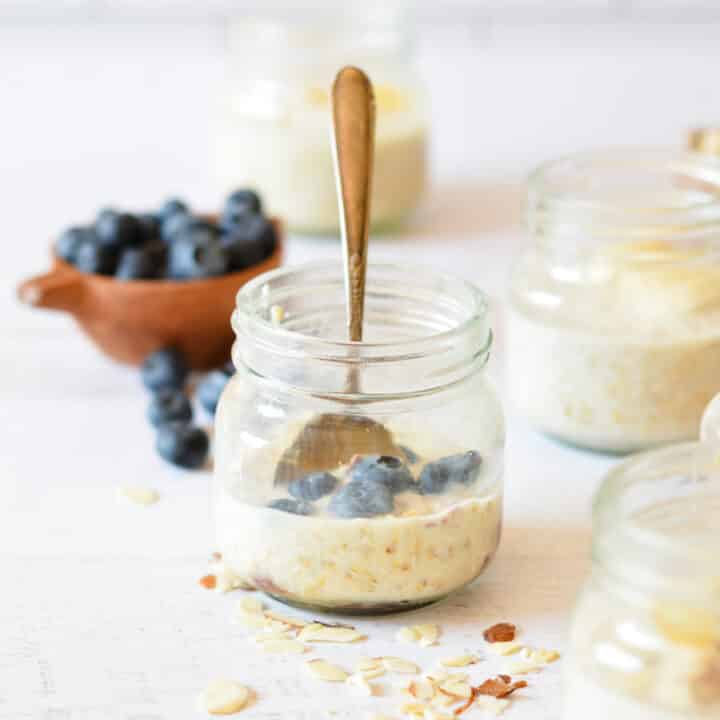 a jar of overnight oats with blueberries.