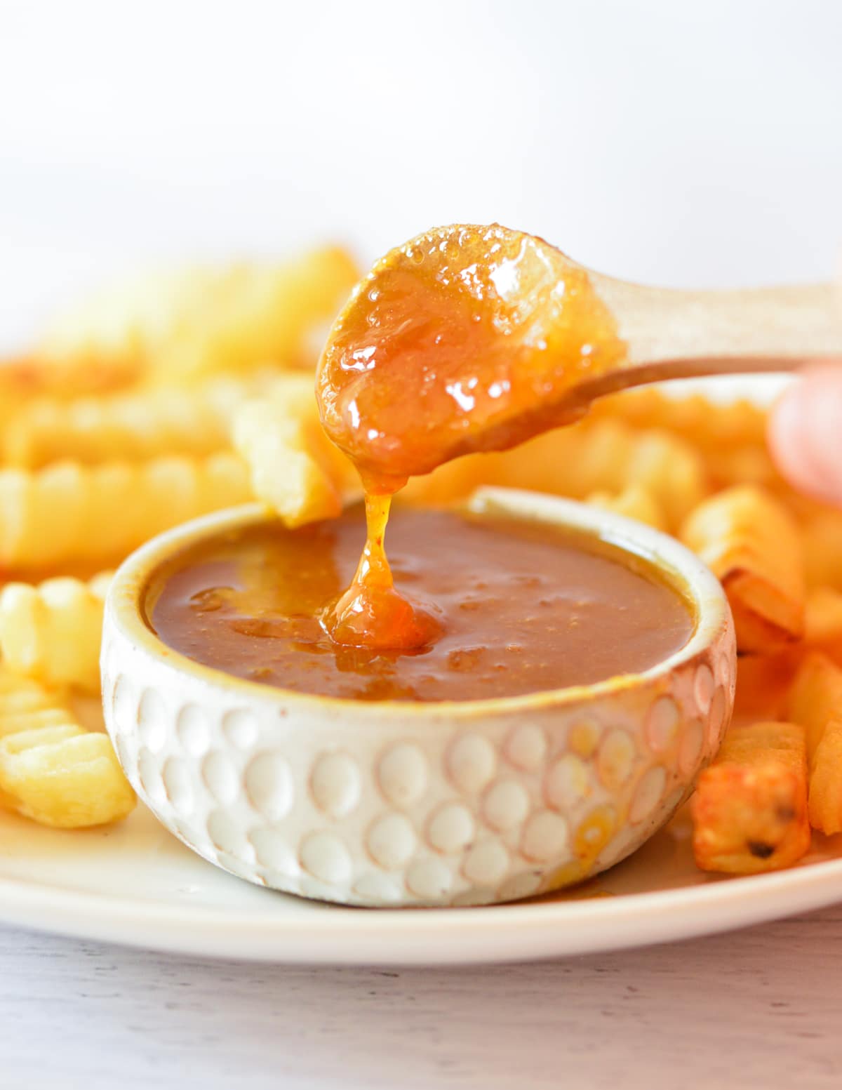 a spoonful of sweet and sour sauce.