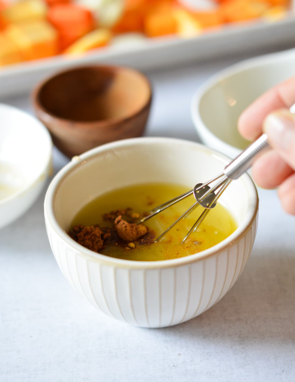 butter, oil, sugar, and spices in a small bowl with a small whisk.