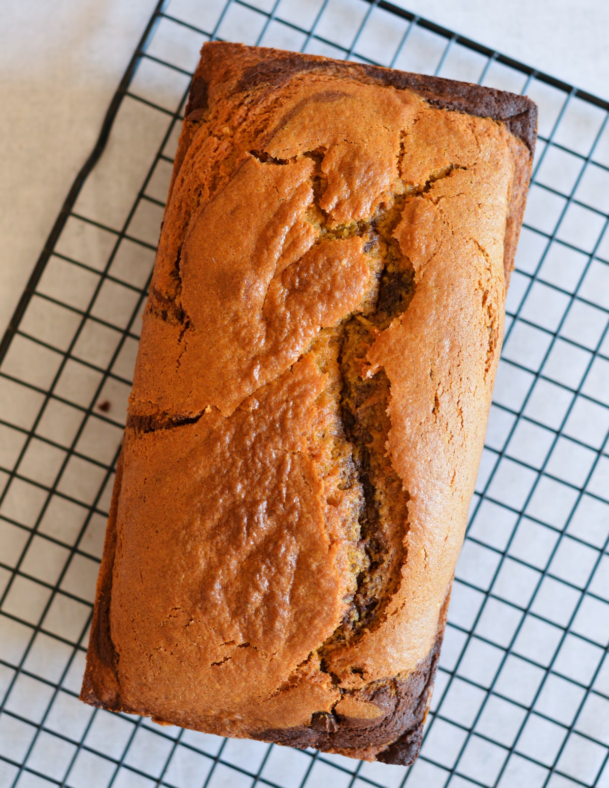 gluten free pumpkin bread on a wire rack.