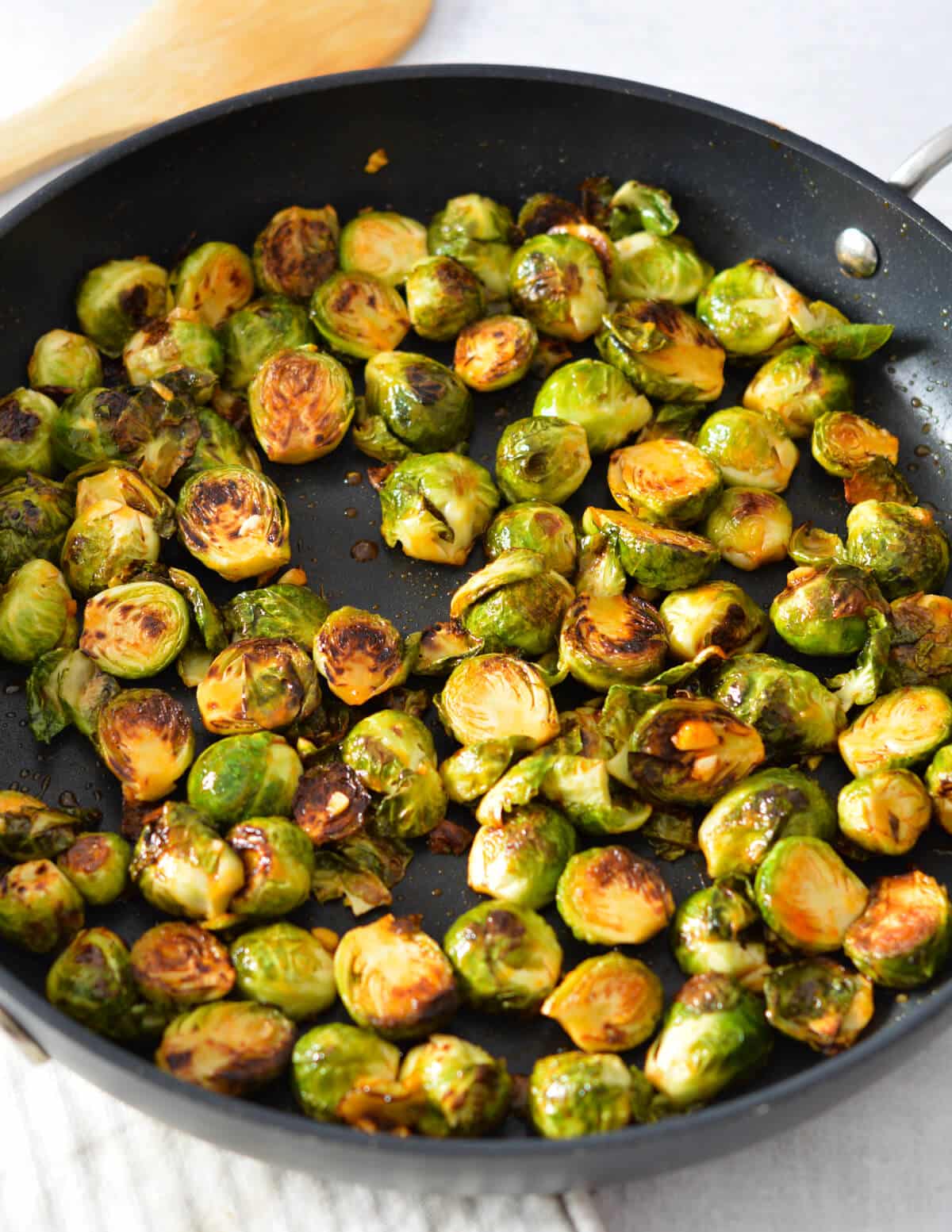 sriracha brussels sprouts in a skillet.
